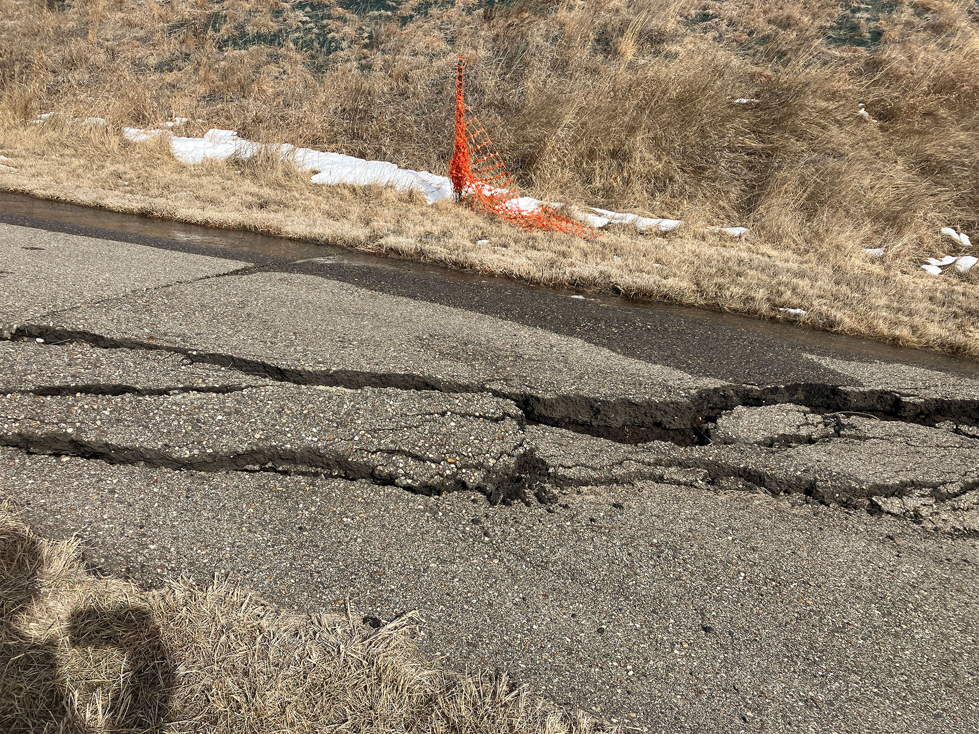 Cracks in the pedestrian path caused by slumping at Double Ditch
